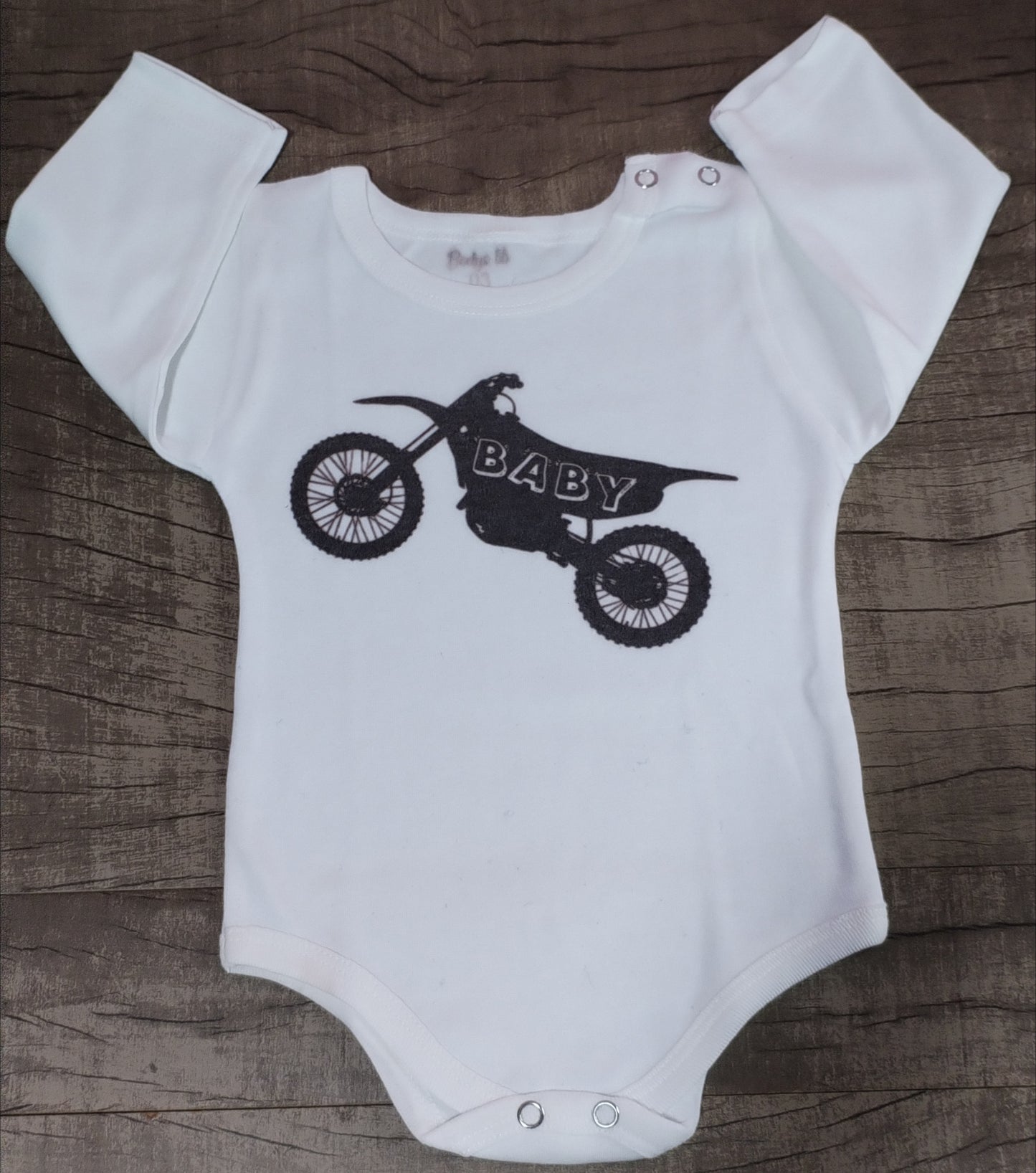 Body moto baby (quedo con una pelusa en la tela) talle 3 manga larga